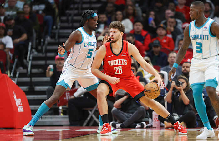 Rockets center Alperen Sengun (28) controls the ball as Charlotte Hornets center Mark Williams (5) defends during the second quarter at Toyota Center